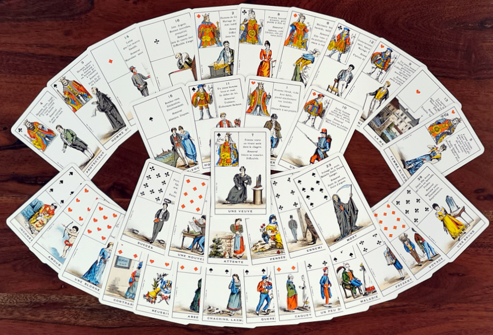 Cards from Le Petit Cartomancien deck laid out on a table